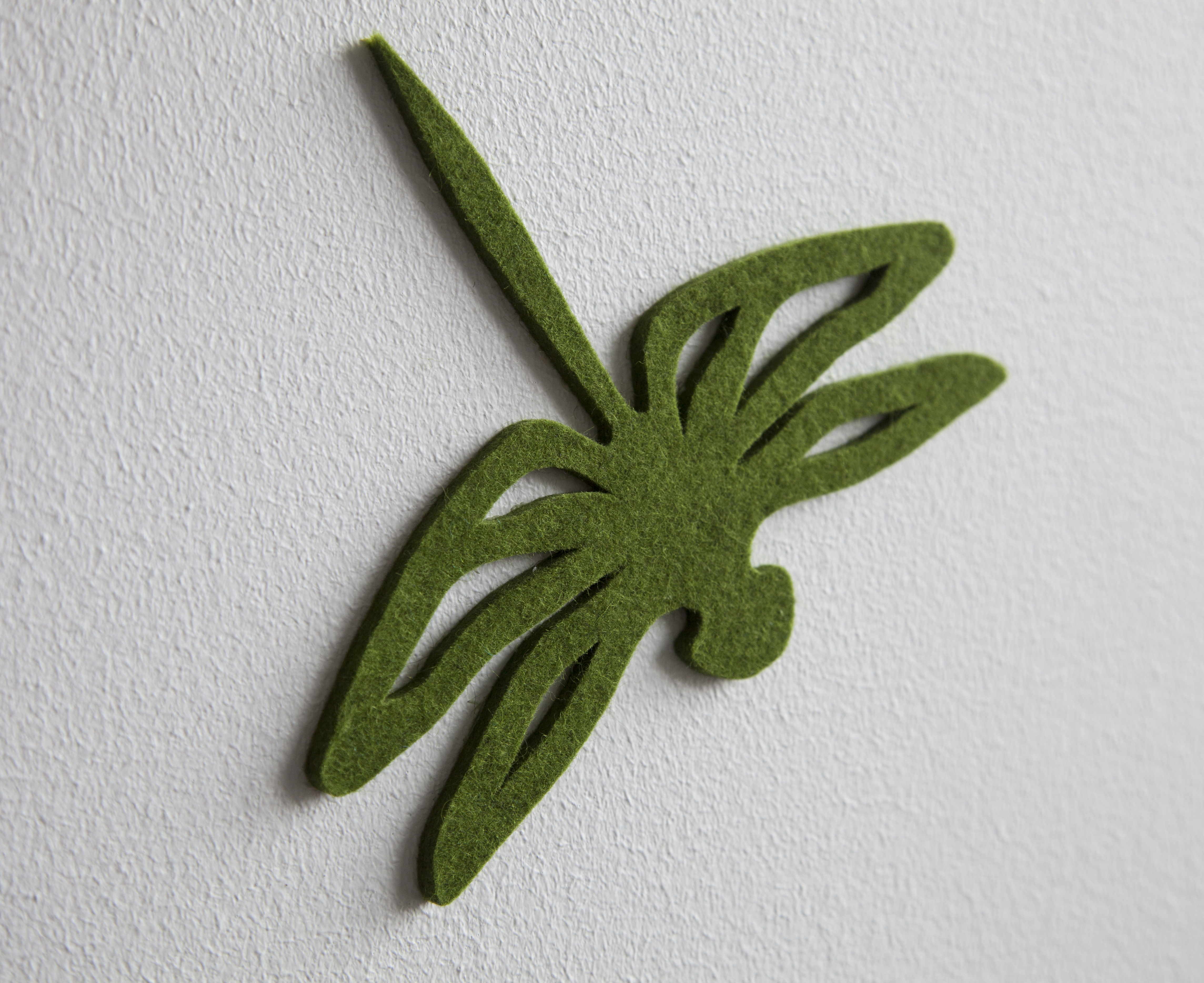 Fraster filt udskåret som guldsmed opklæbet på væg